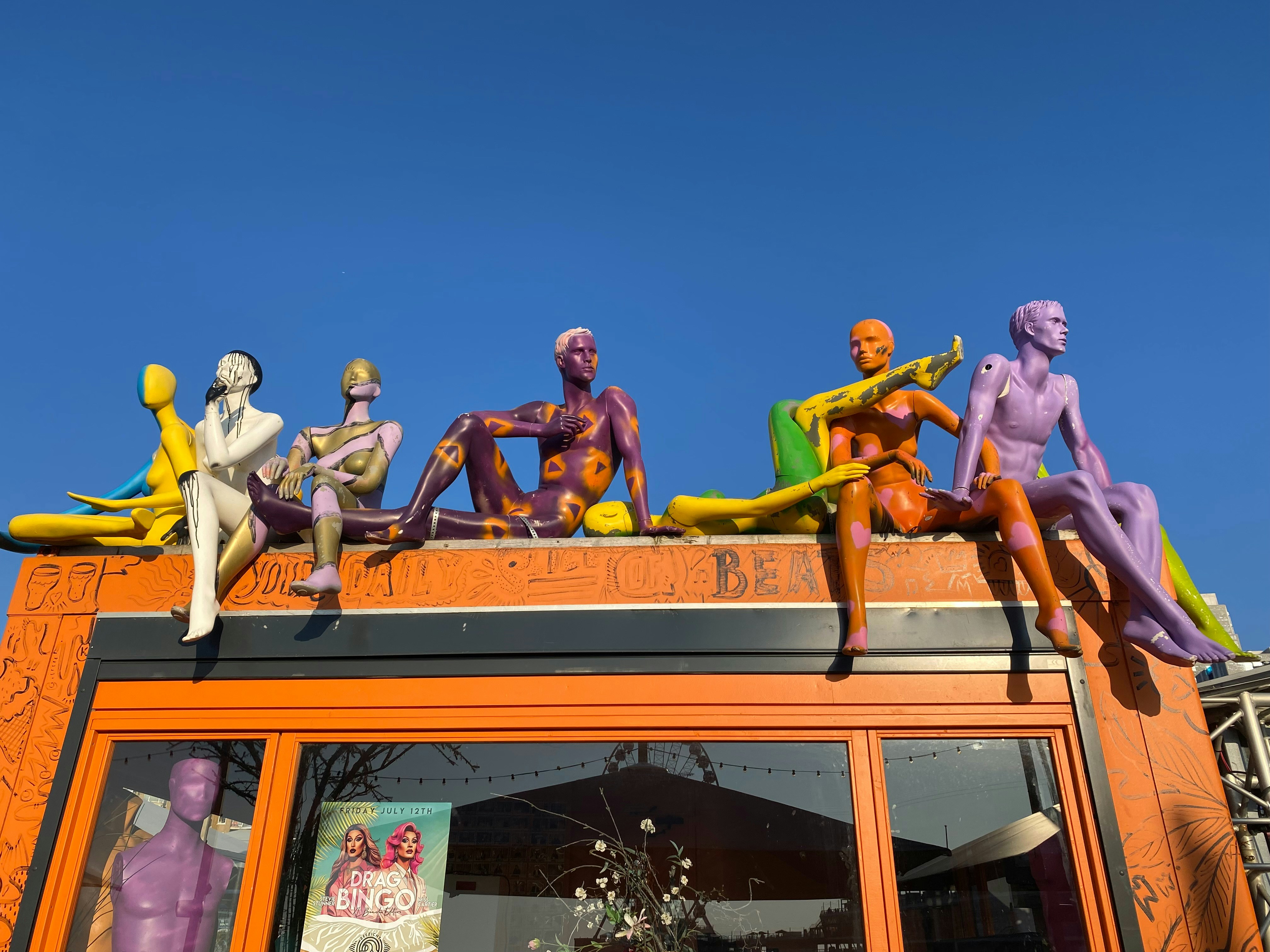 A group of figurines sitting on top of a building