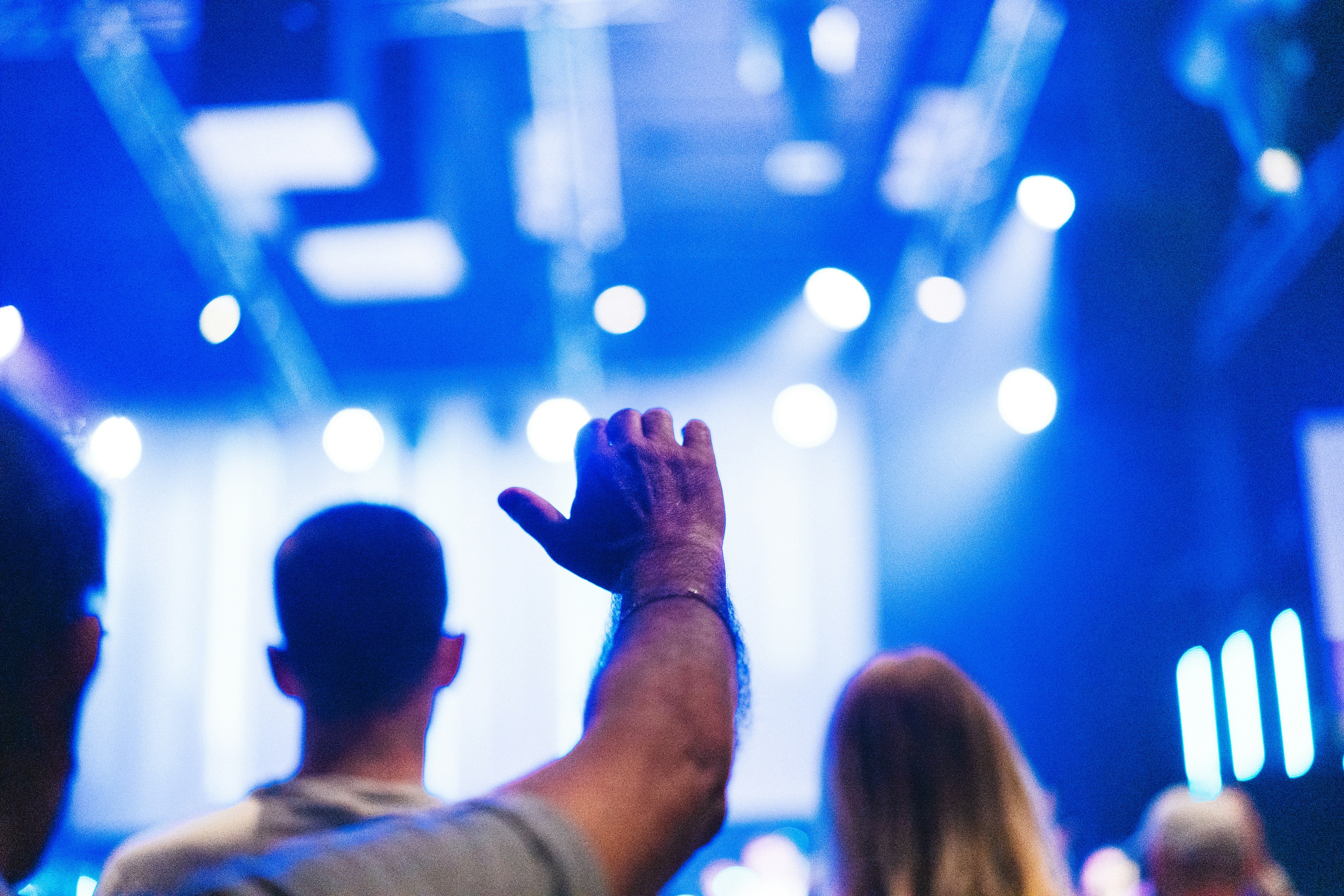 A group of people standing in front of a stage
