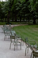 A row of chairs sitting on top of a sidewalk