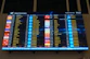 A large screen displaying a flight schedule at an airport