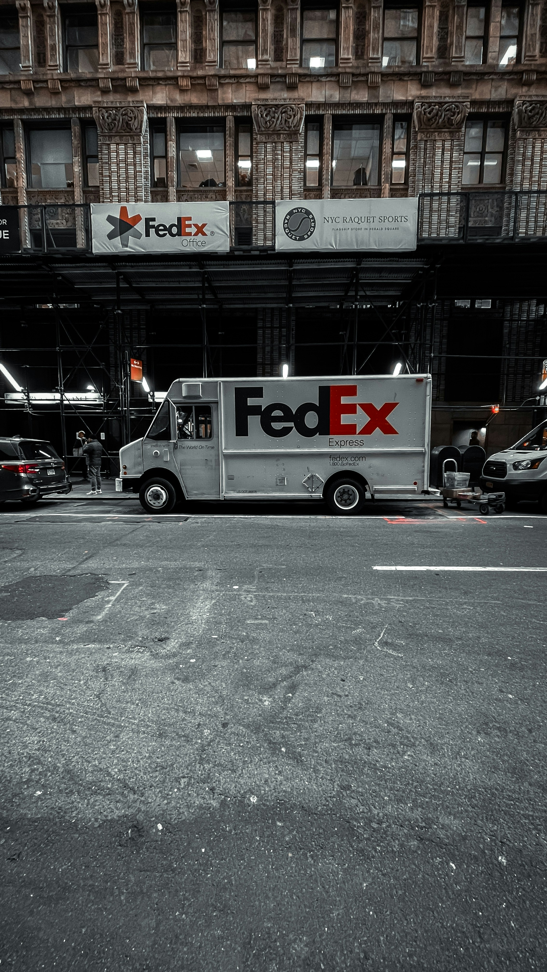 A fed ex truck parked in a parking lot