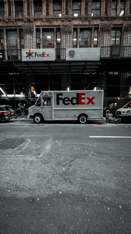 A fed ex truck parked in a parking lot