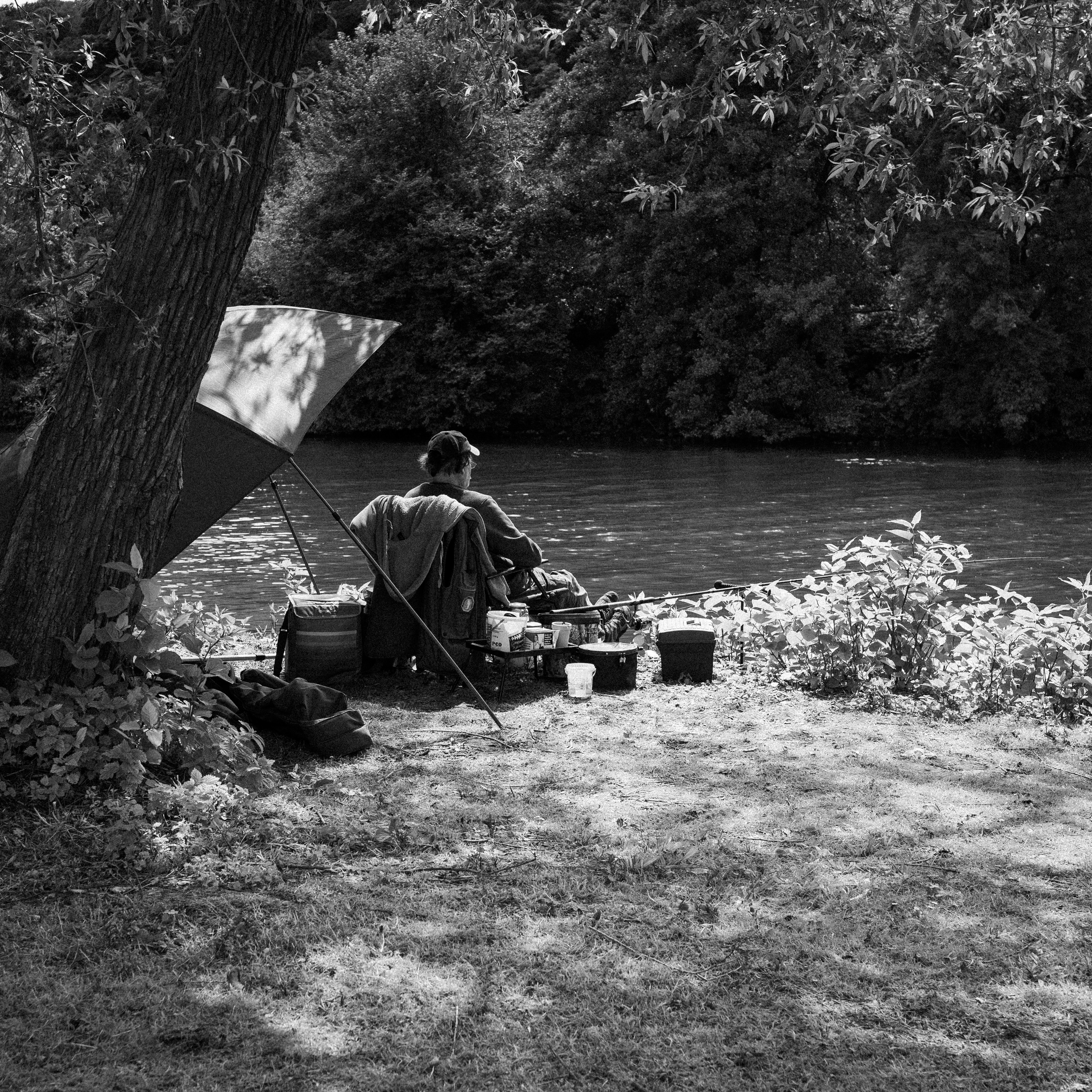 A person enjoying free time outdoors, looking relaxed.