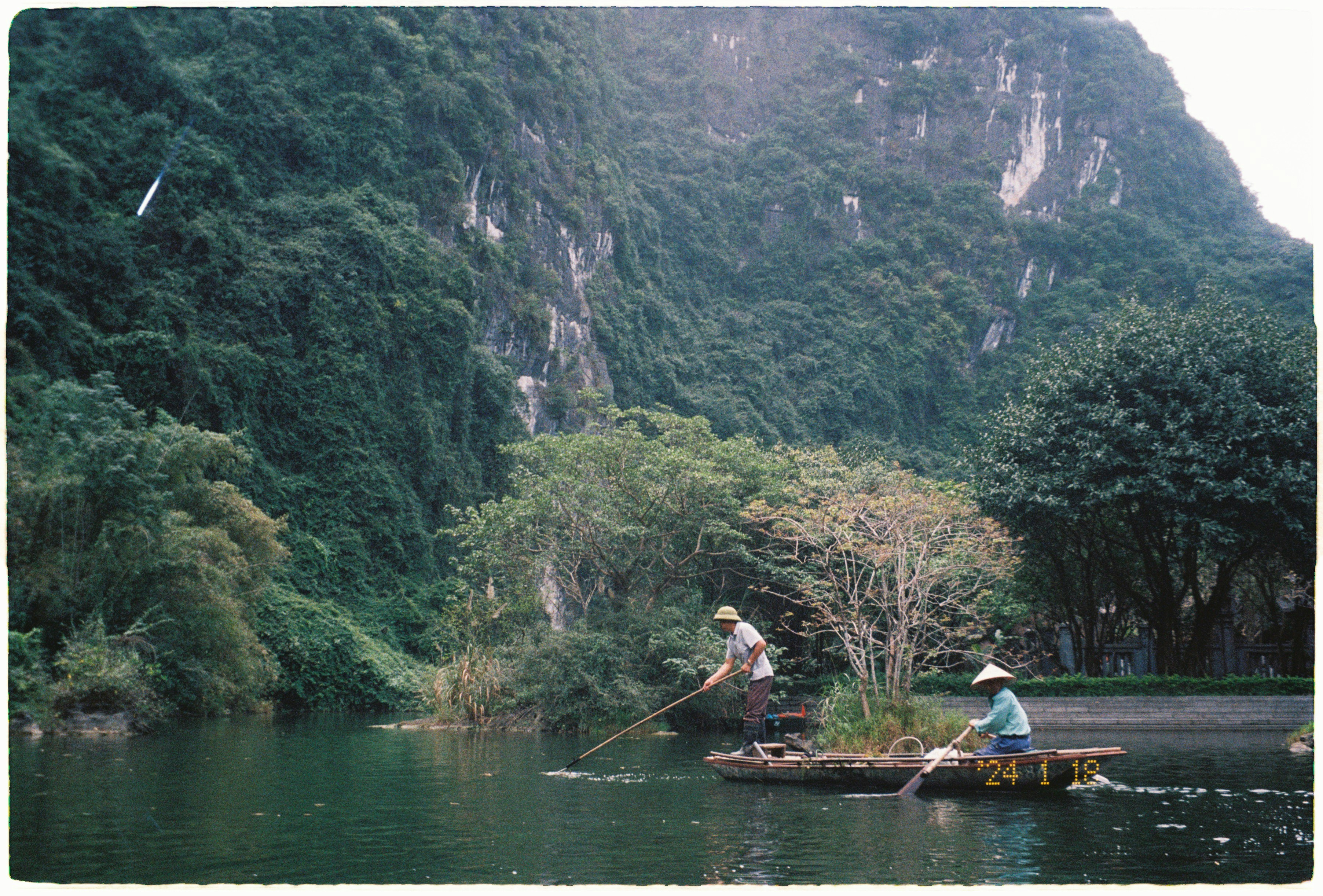 Two people in a boat on a river