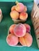A bunch of peaches sitting on a table