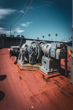 A couple of large machines sitting on top of a wooden floor