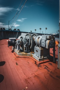 A couple of large machines sitting on top of a wooden floor
