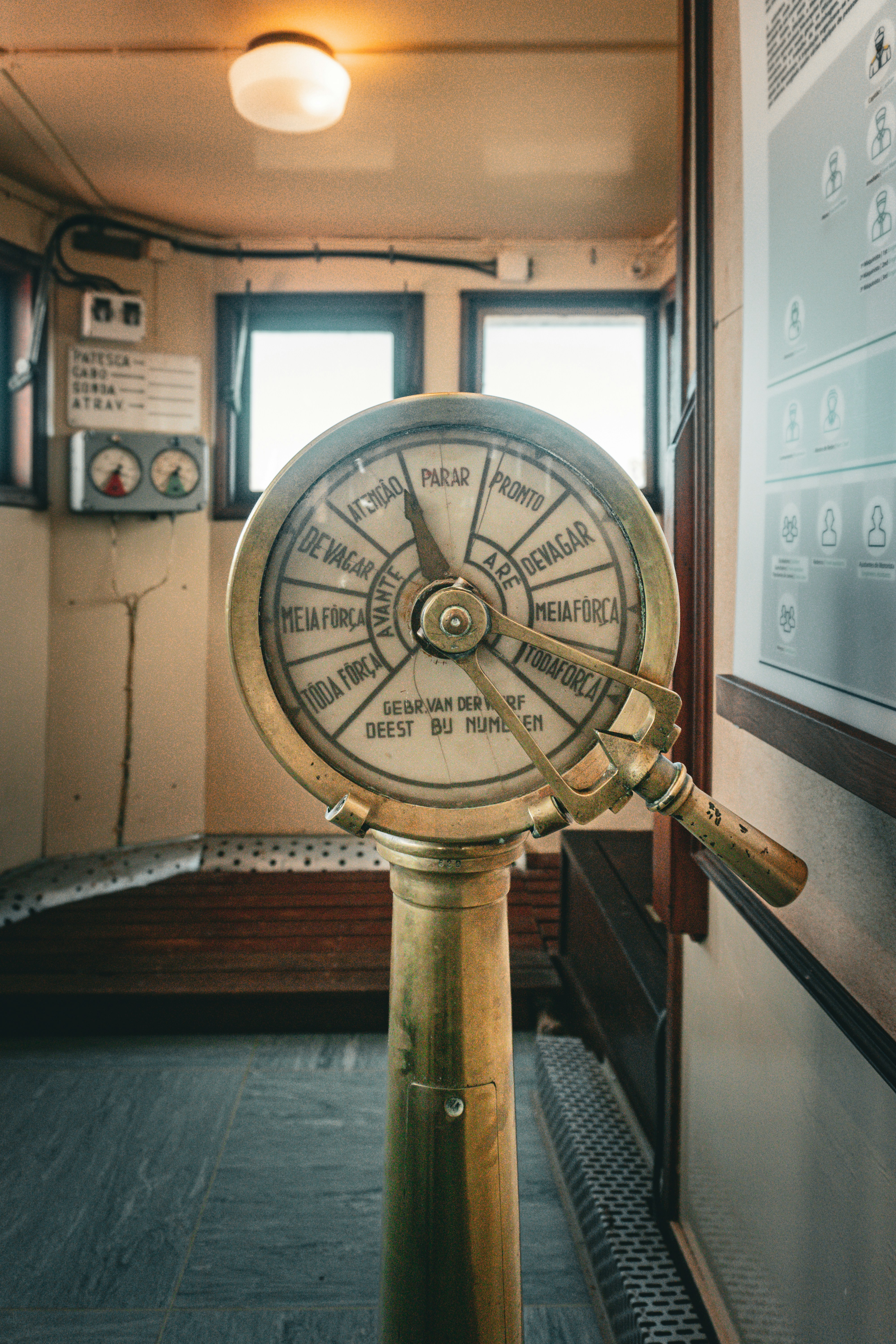 A large metal clock sitting in the middle of a room