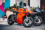 A couple of motorcycles parked next to each other