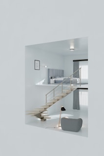 A white room with stairs and a couch