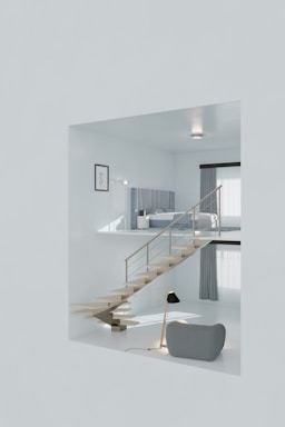 A white room with stairs and a couch