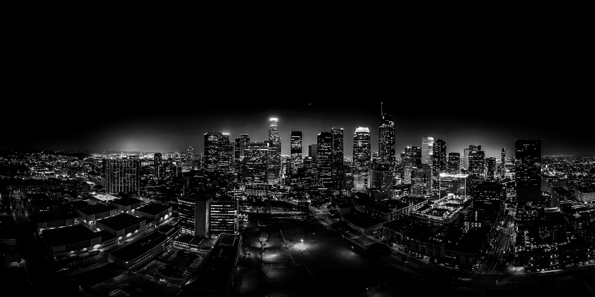 A black and white photo of a city at night
