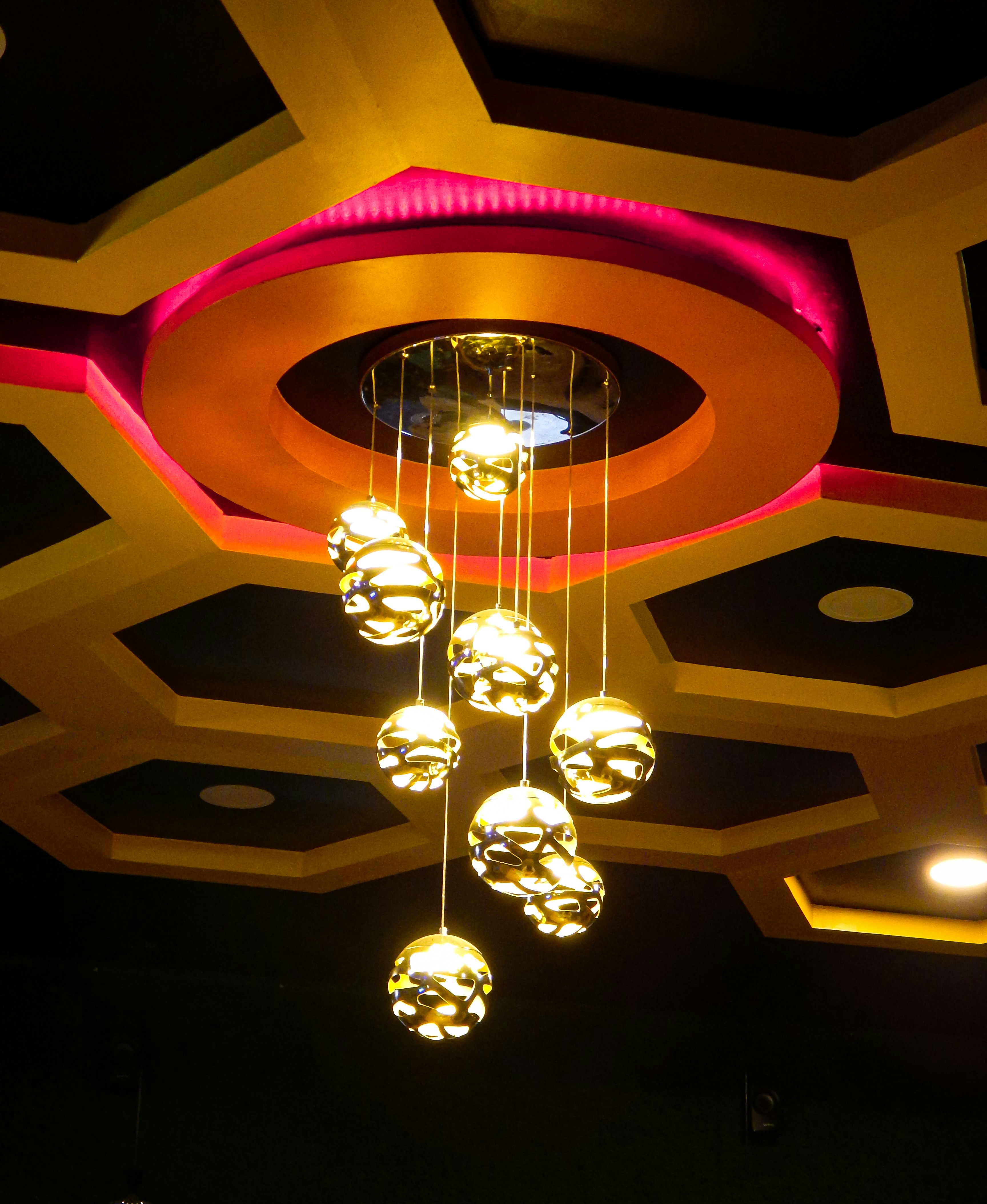 A chandelier hanging from the ceiling of a restaurant