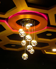 A chandelier hanging from the ceiling of a restaurant