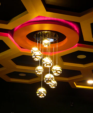 A chandelier hanging from the ceiling of a restaurant
