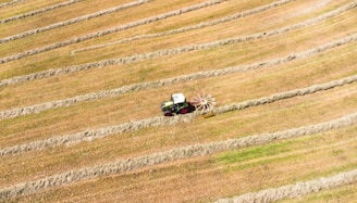 An aerial view of a tractor in a field