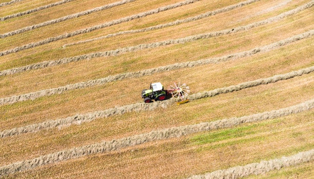 An aerial view of a tractor in a field
