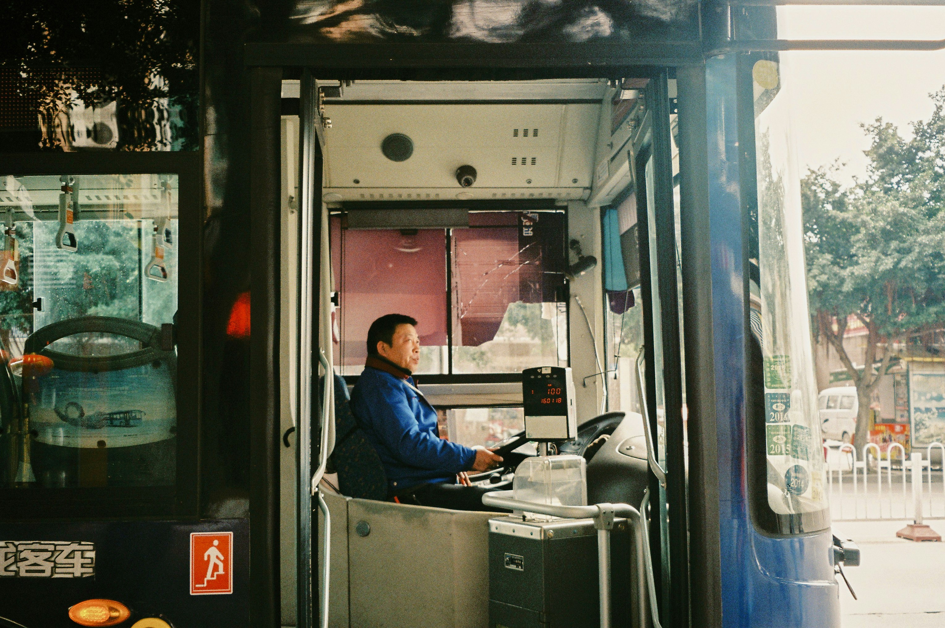A man sitting at a desk in a bus