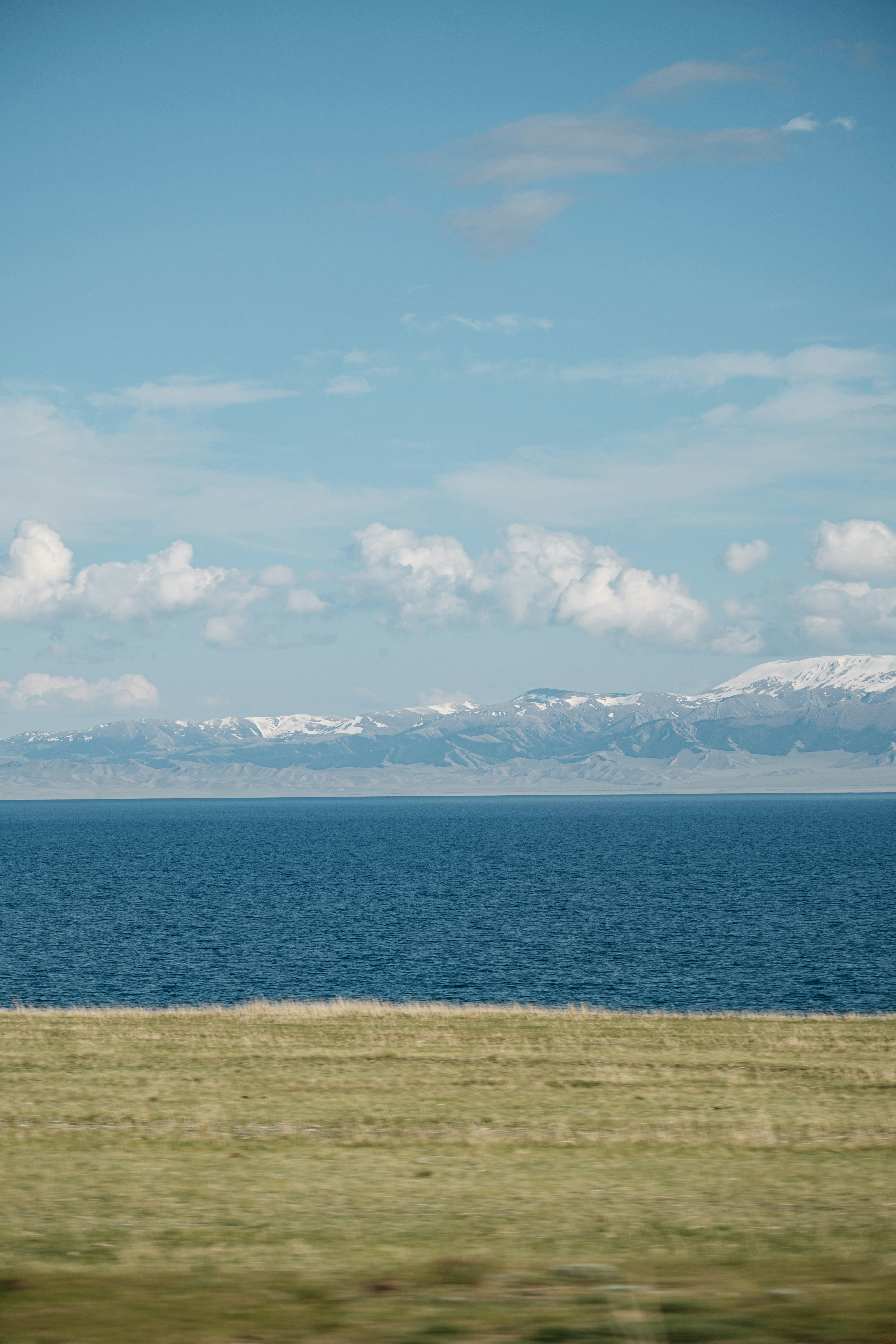 A large body of water with mountains in the background