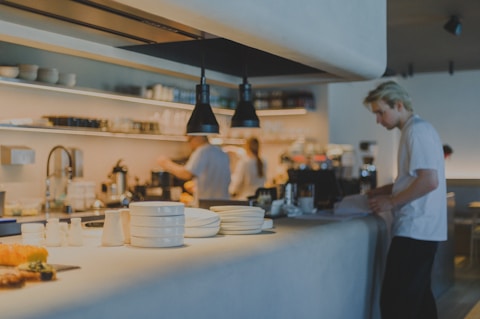 A man standing in a kitchen preparing food