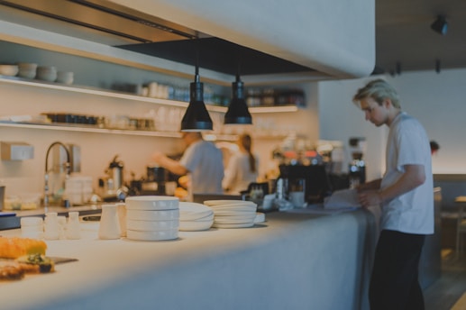 A man standing in a kitchen preparing food