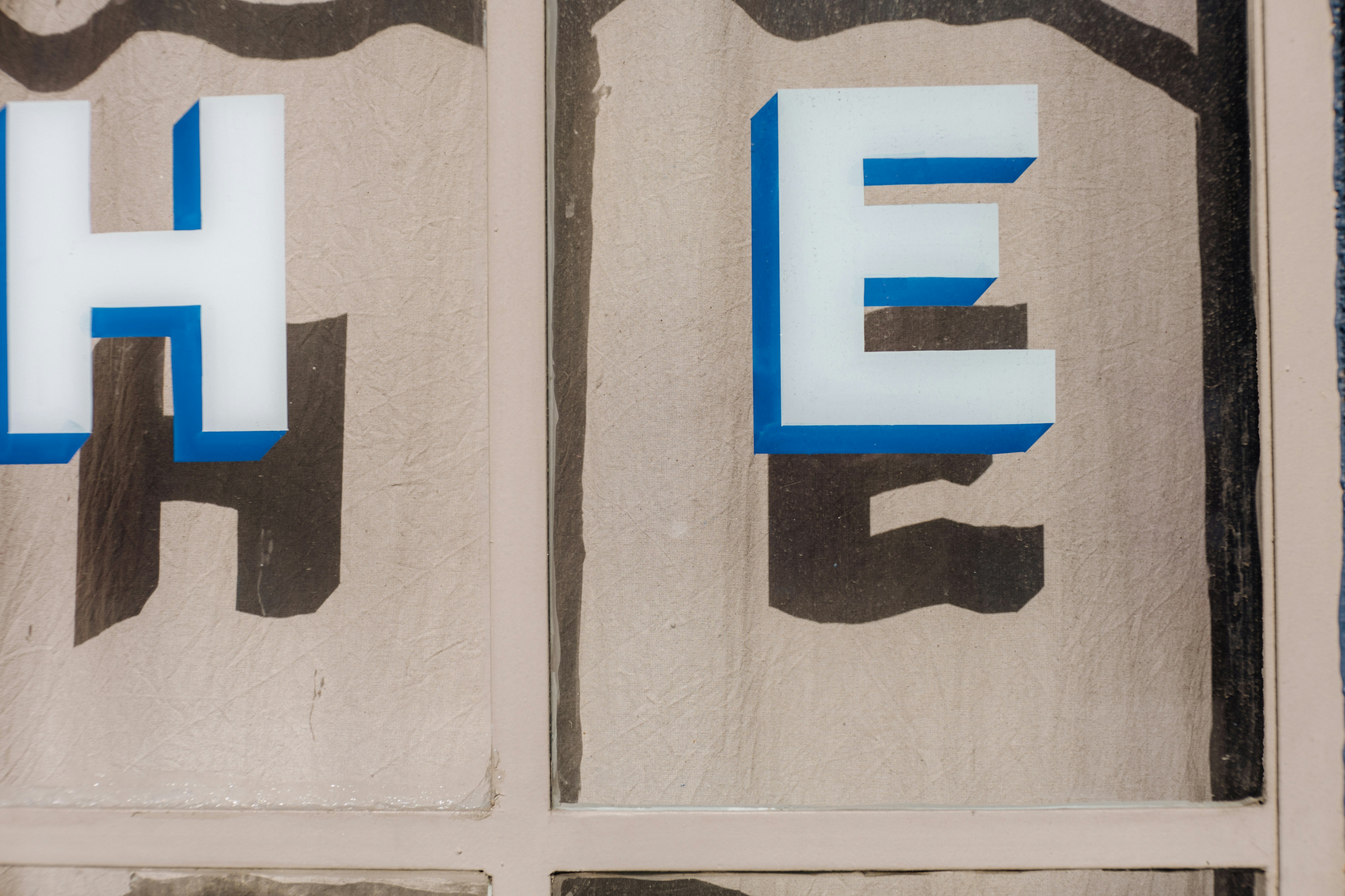 A close up of a sign on a building photo – Free Grey Image on Unsplash