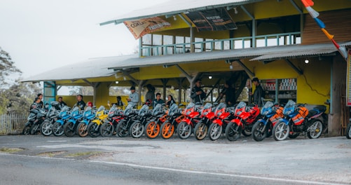 A row of motorcycles parked in front of a building