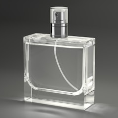 A clear glass bottle with a silver top