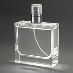 A clear glass bottle with a silver top