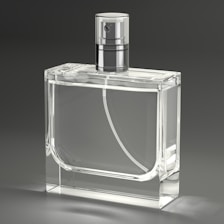 A clear glass bottle with a silver top