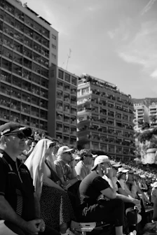 A large group of people sitting in a crowd