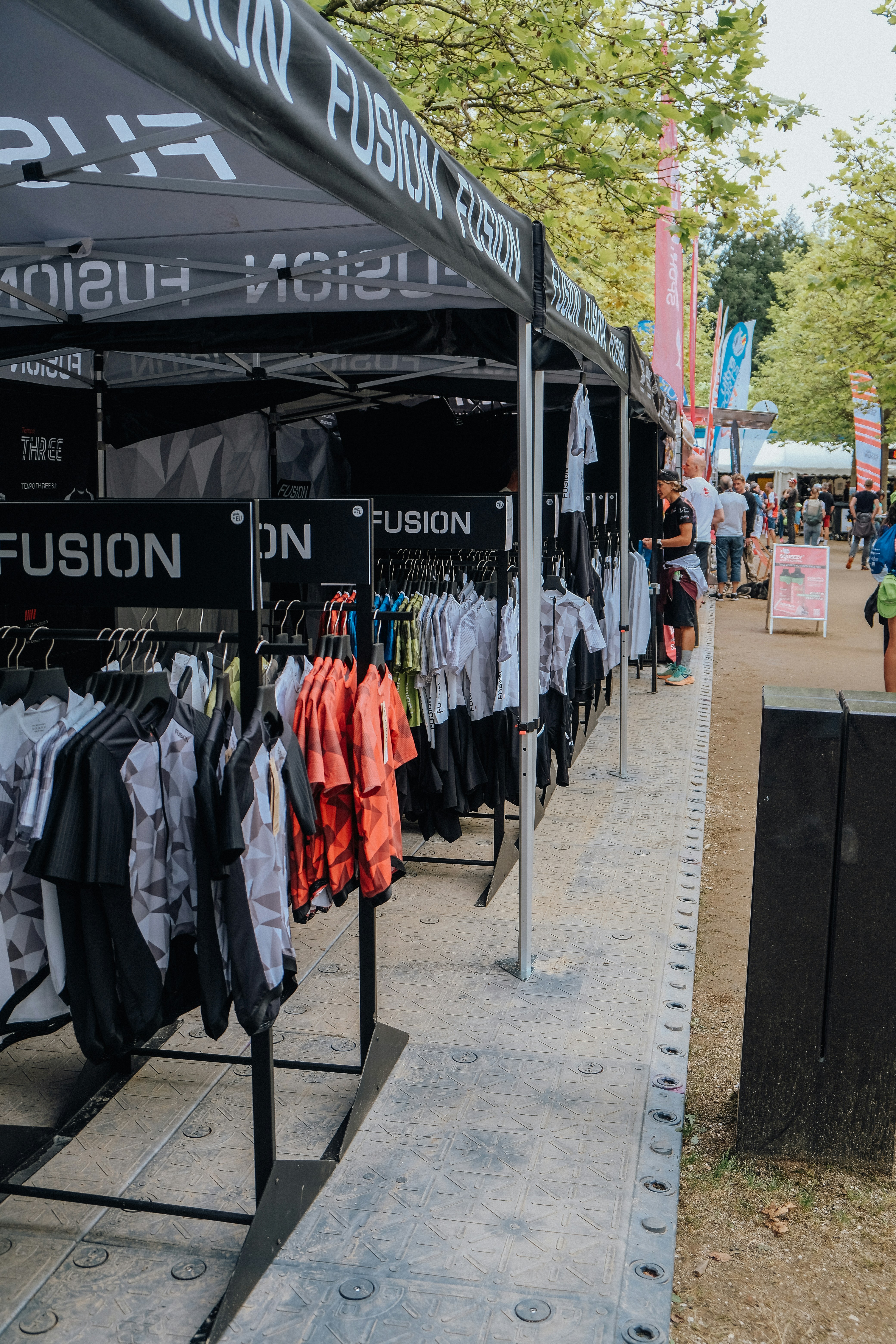 A group of people standing under a tent