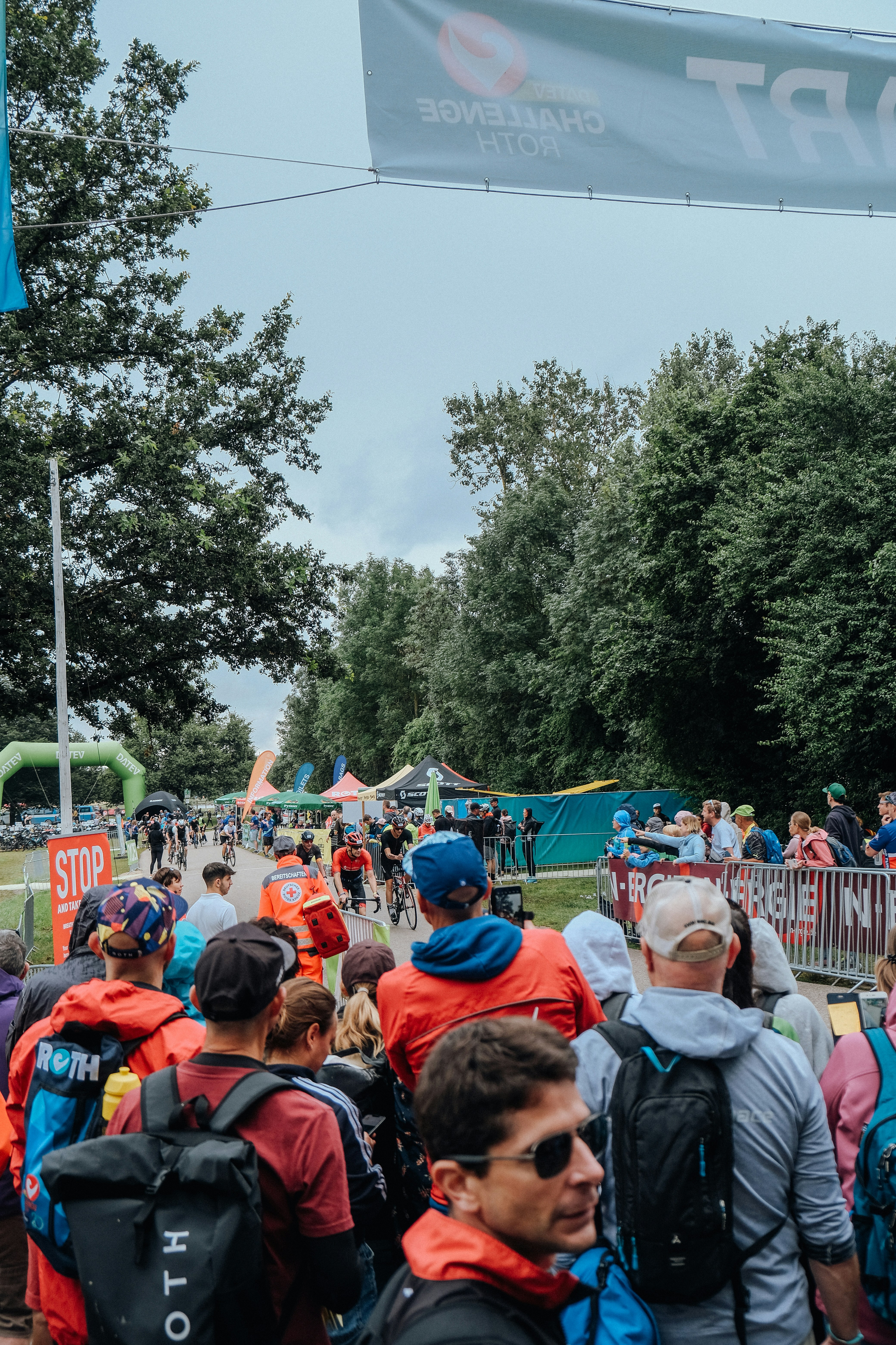 A large group of people walking down a street