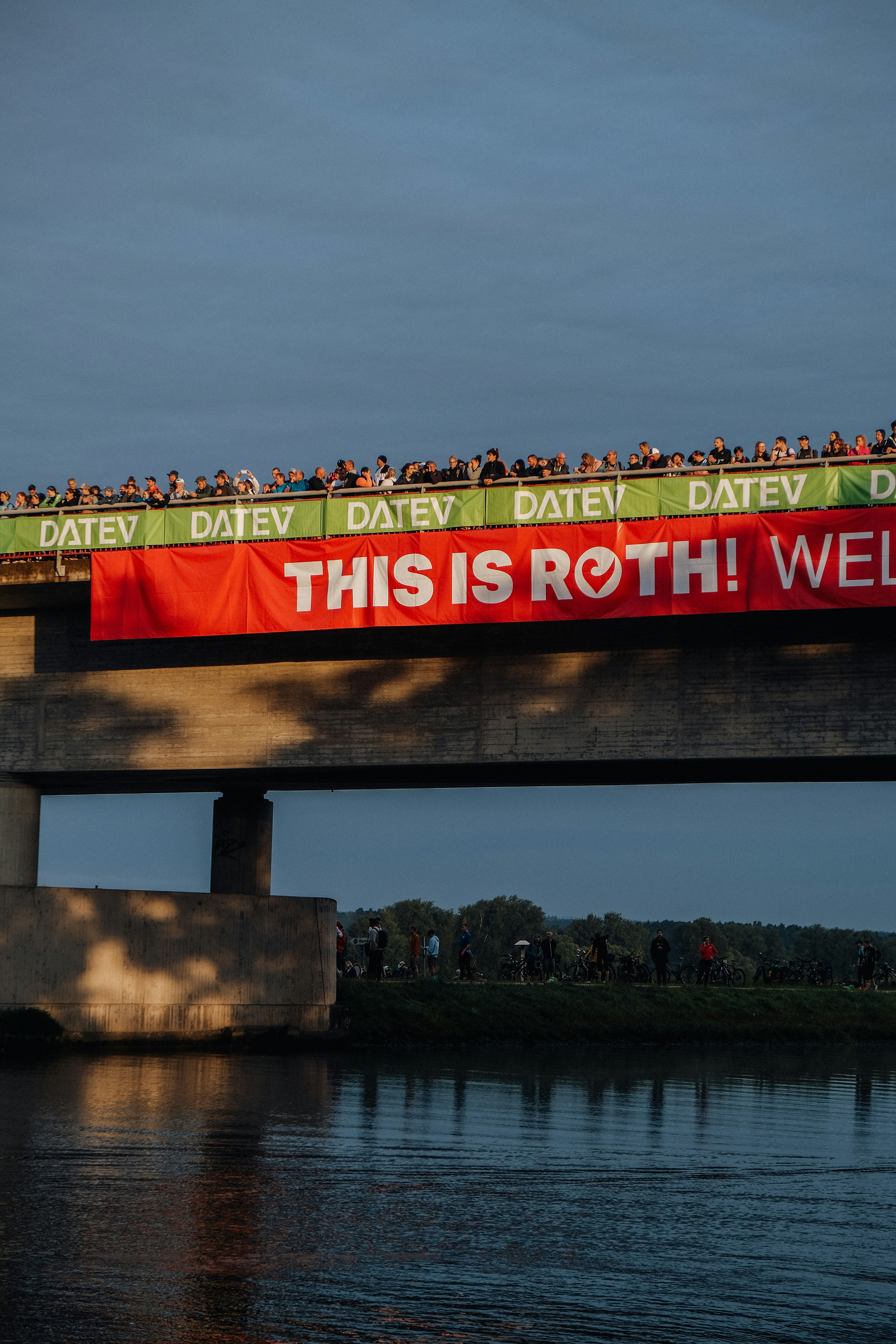 A train with a long line of people riding on top of it