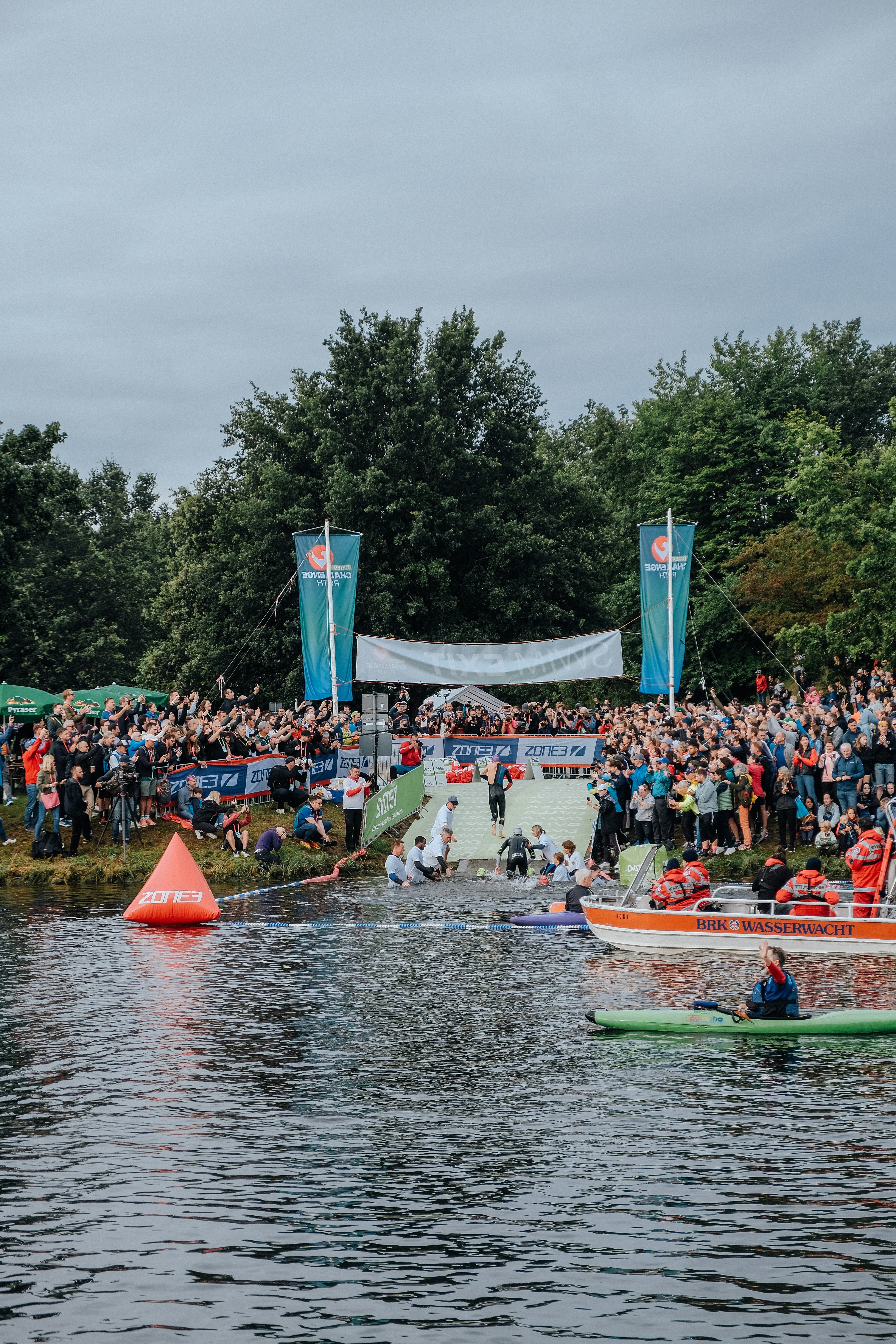 A group of people in boats on a body of water
