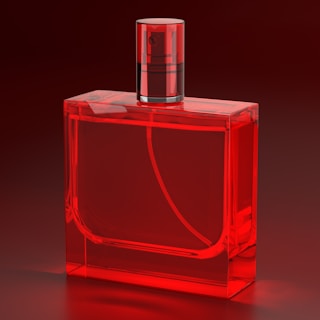 A red glass bottle with a red cap