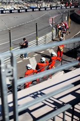 A group of people sitting on top of a race track