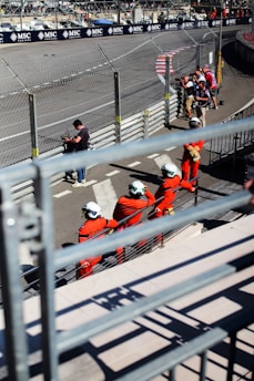 A group of people sitting on top of a race track