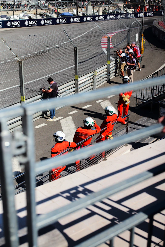 A group of people sitting on top of a race track