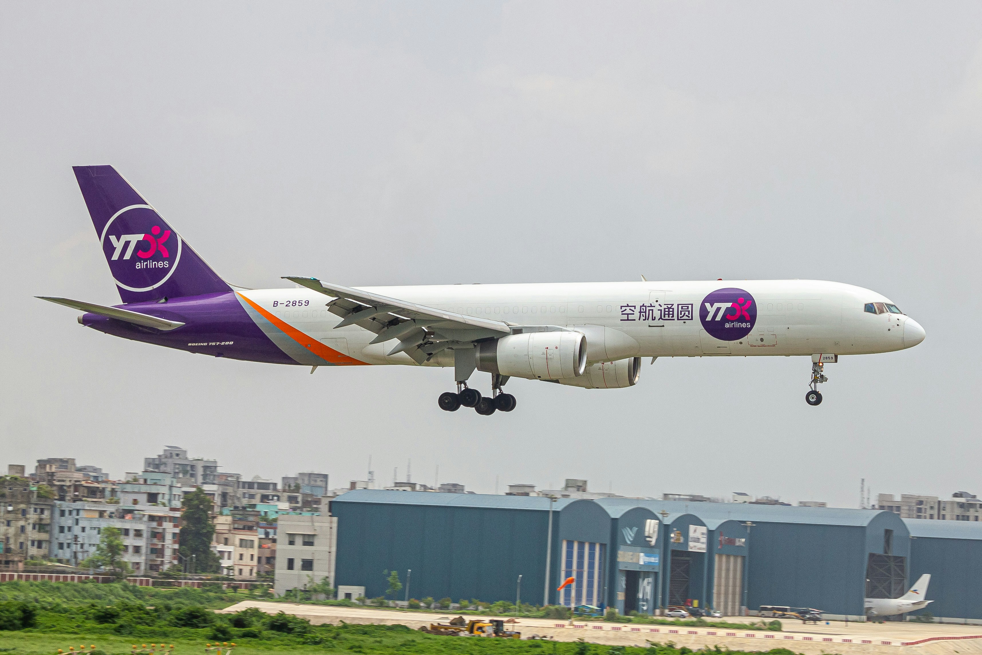 A large jetliner taking off from an airport runway, YTO cargo airlines Boeing 757