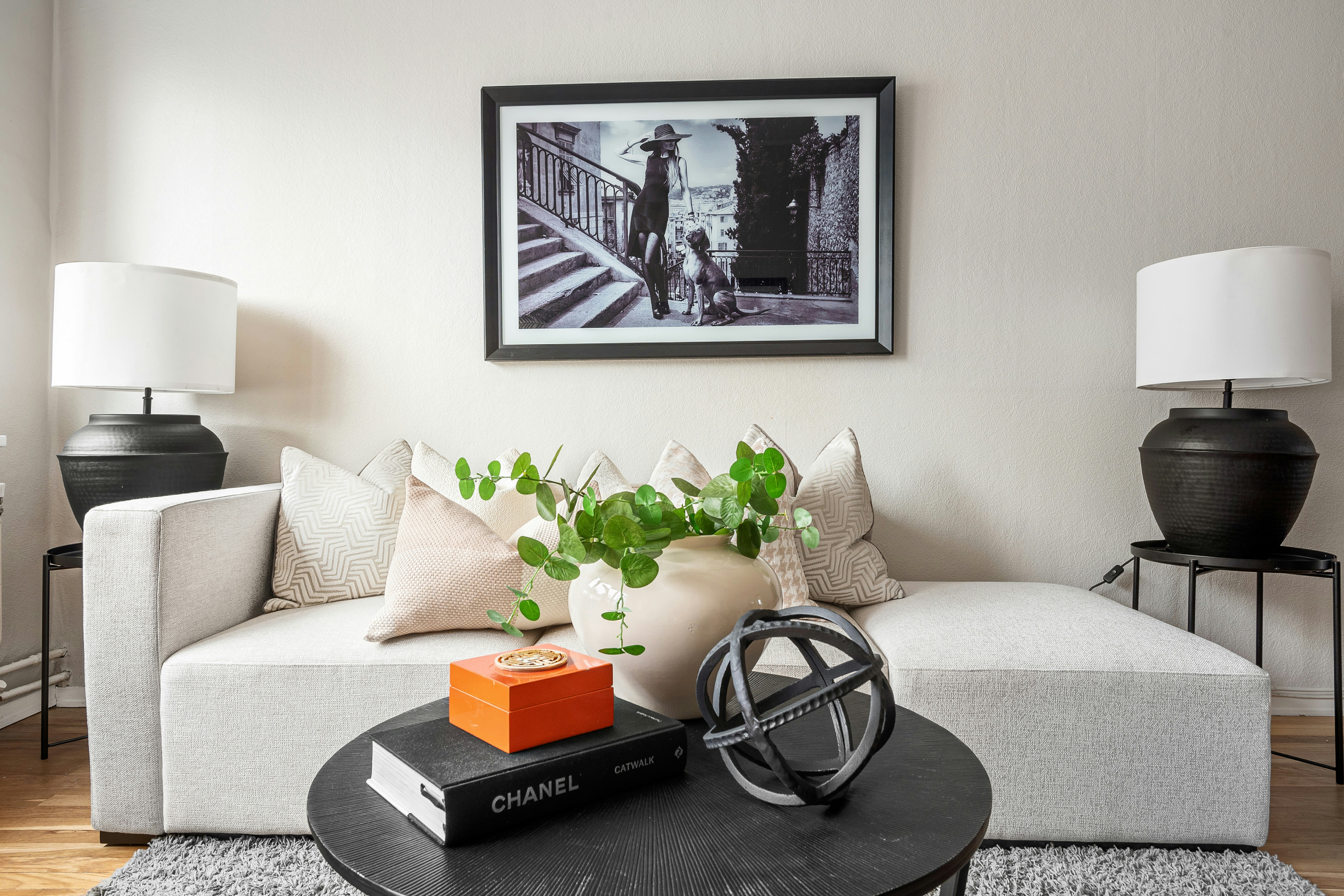 A living room with a white couch and a coffee table