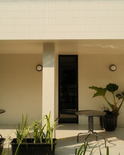 A table and chairs outside of a building