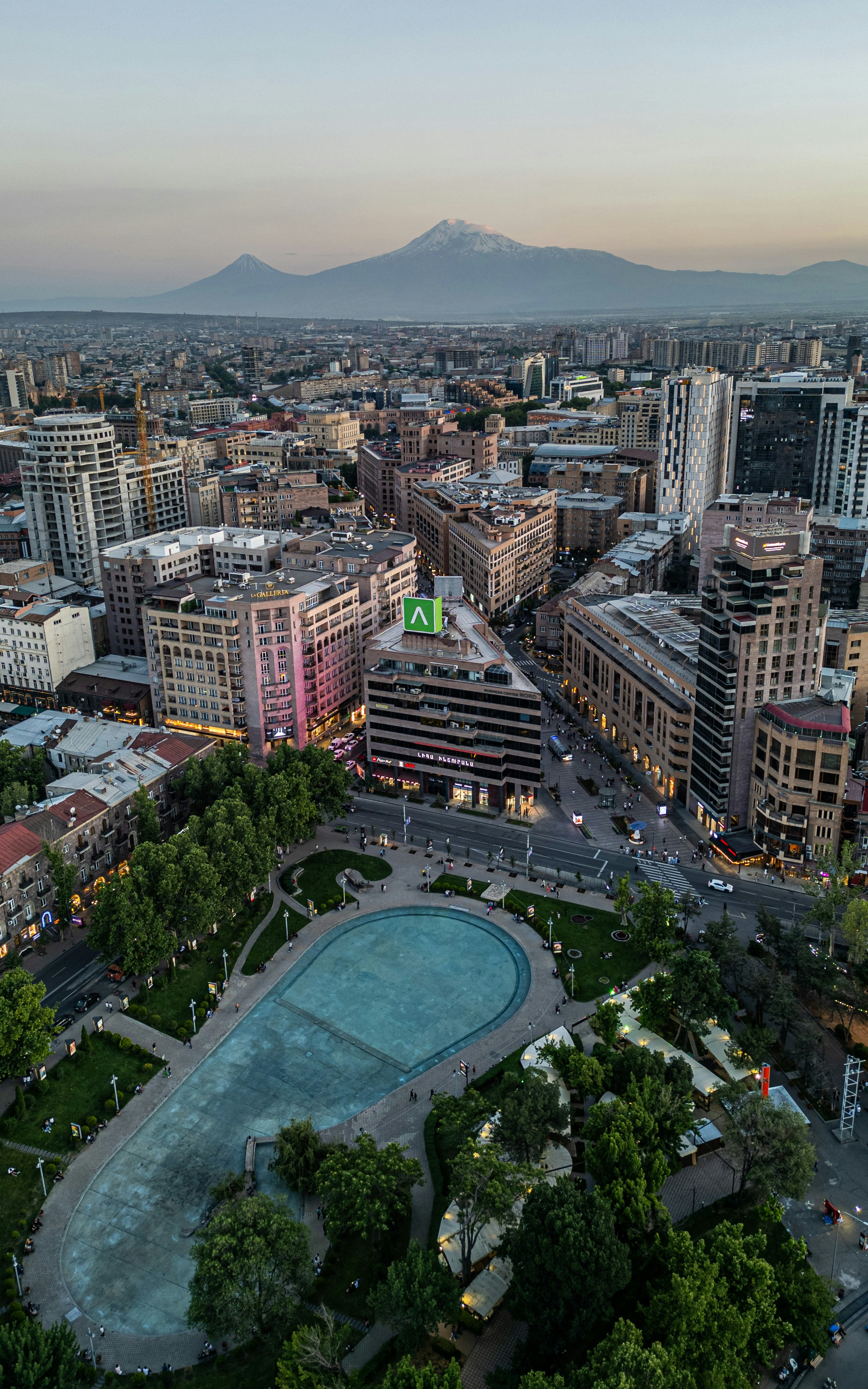 An aerial view of a city at dusk