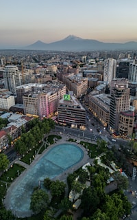 An aerial view of a city at dusk