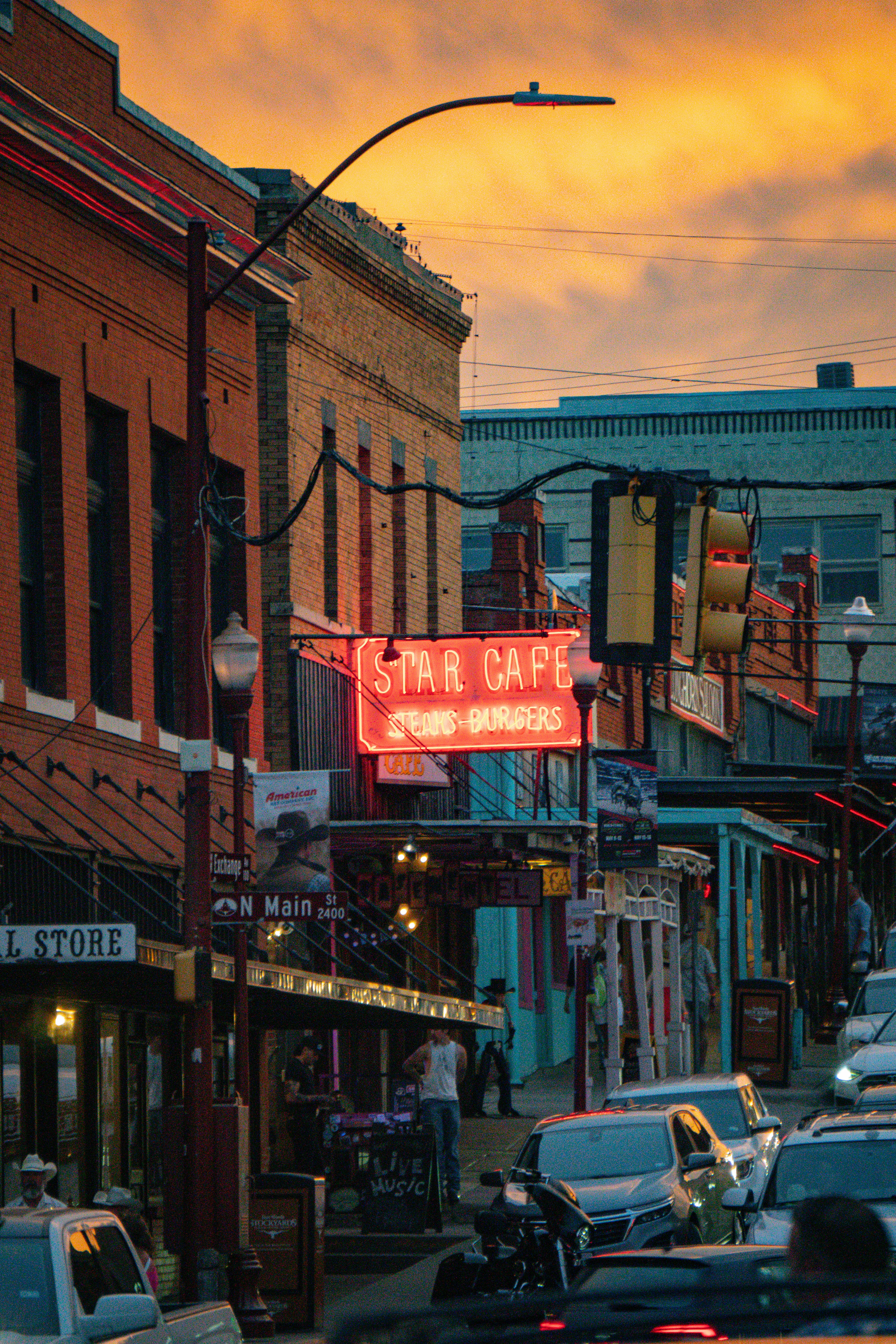A street filled with lots of traffic next to tall buildings