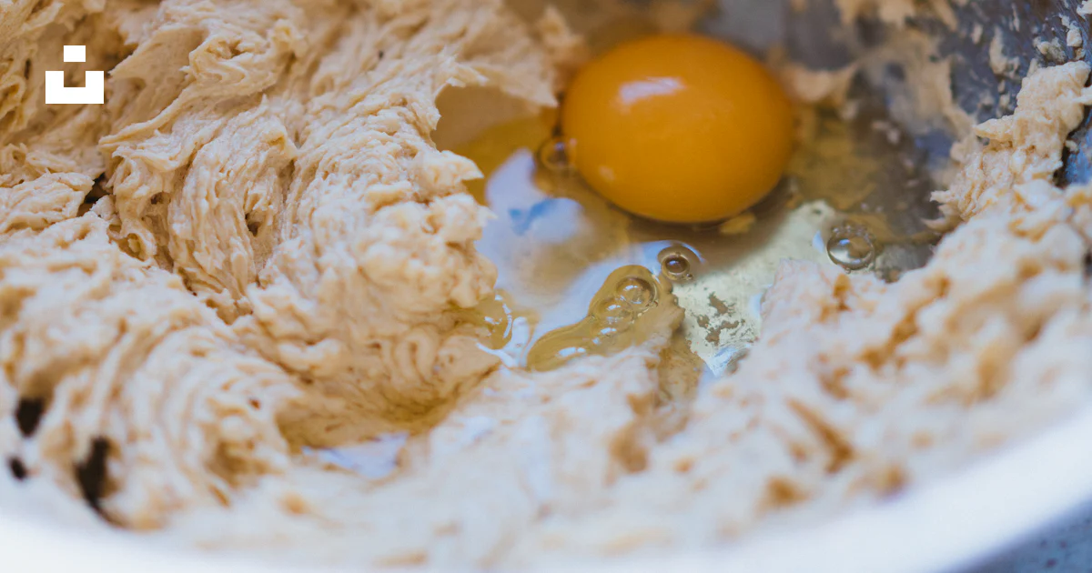 Splashed Batter A metal bowl filled with batter and an egg photo – Free Mixture Image ...