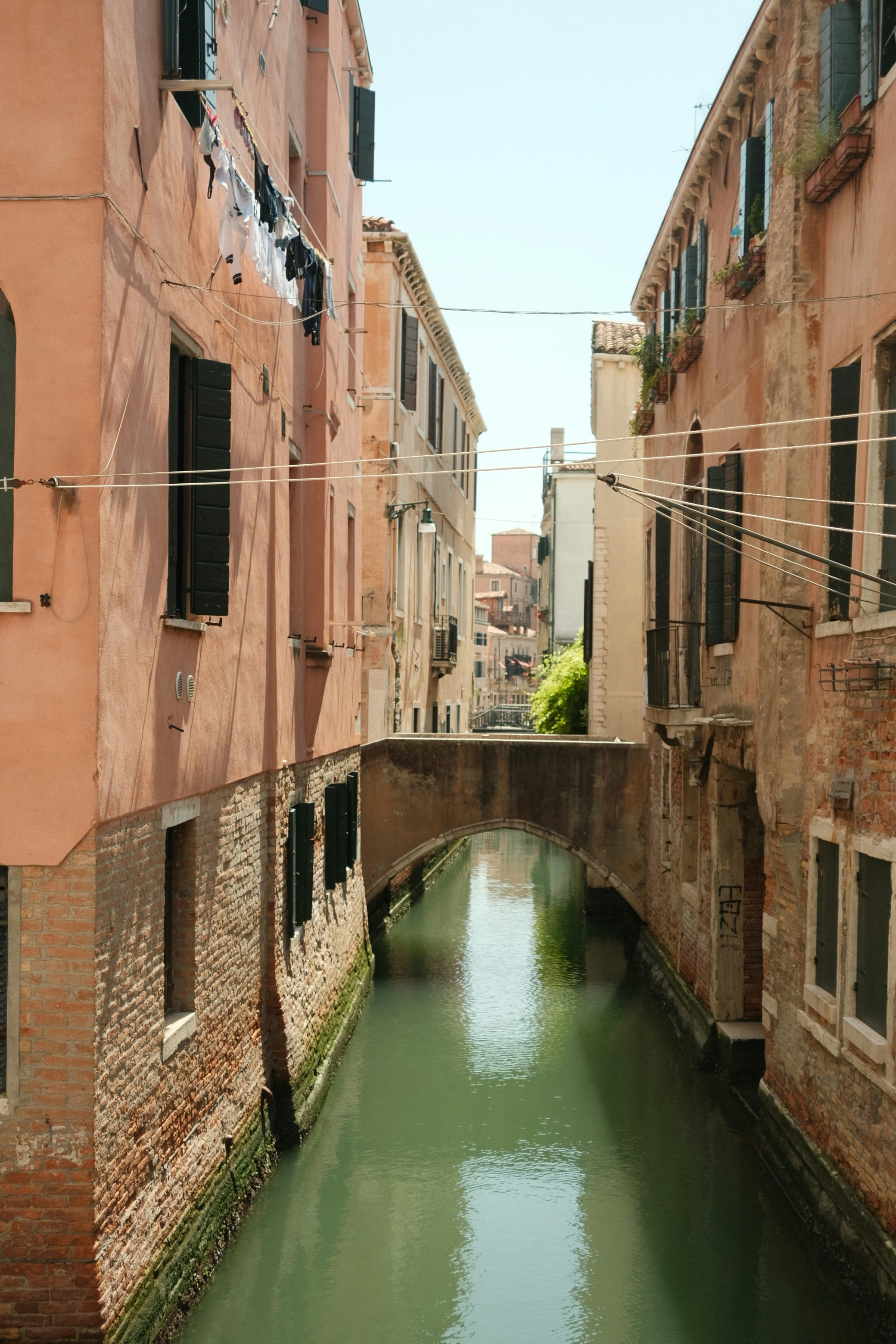 A narrow canal running between two buildings in a city