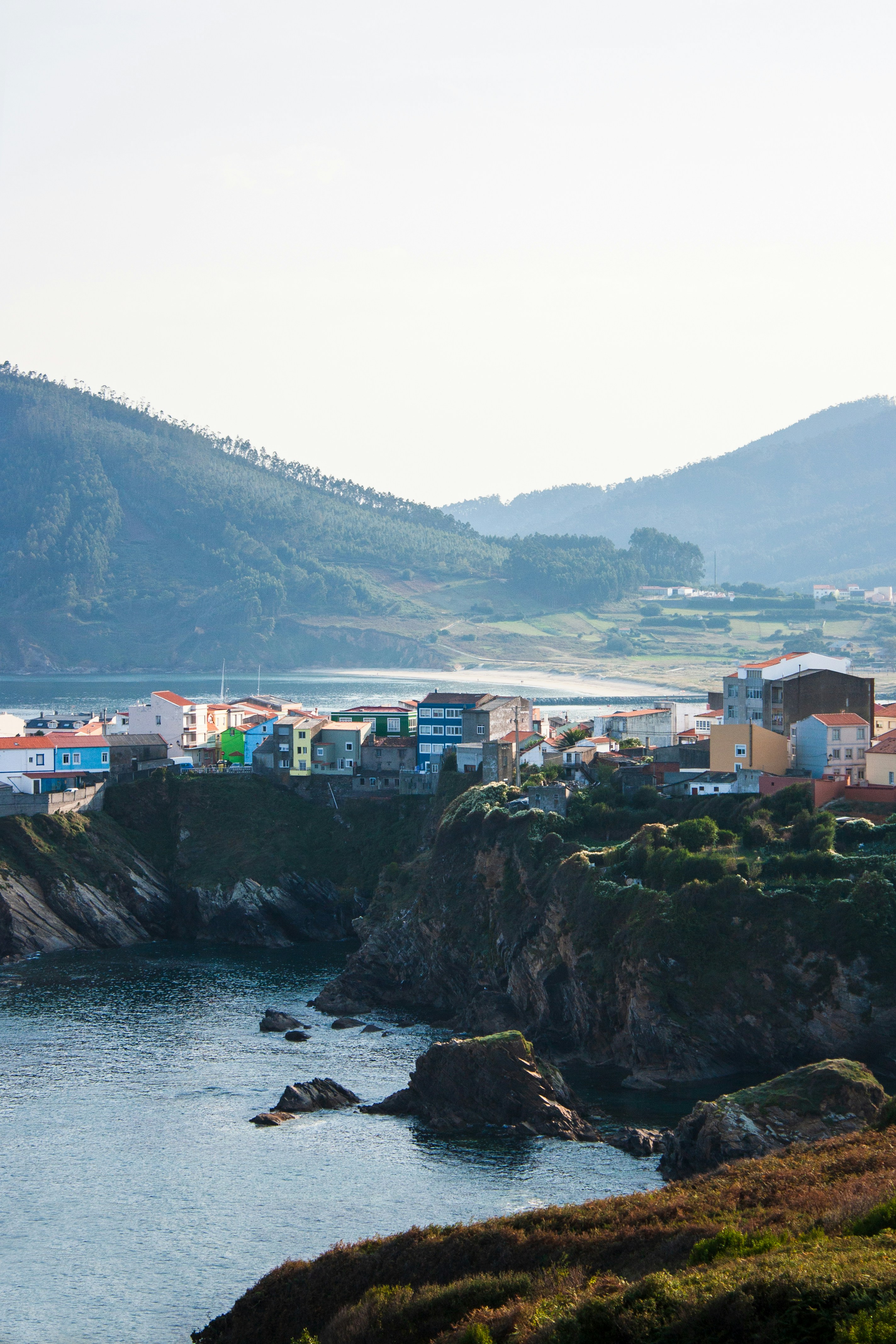 A view of a small town on the shore of a body of water
