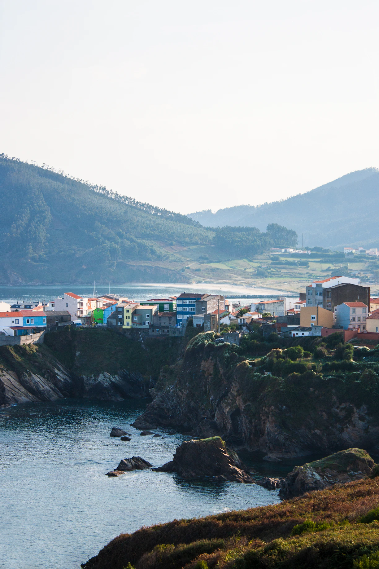 A view of a small town on the shore of a body of water