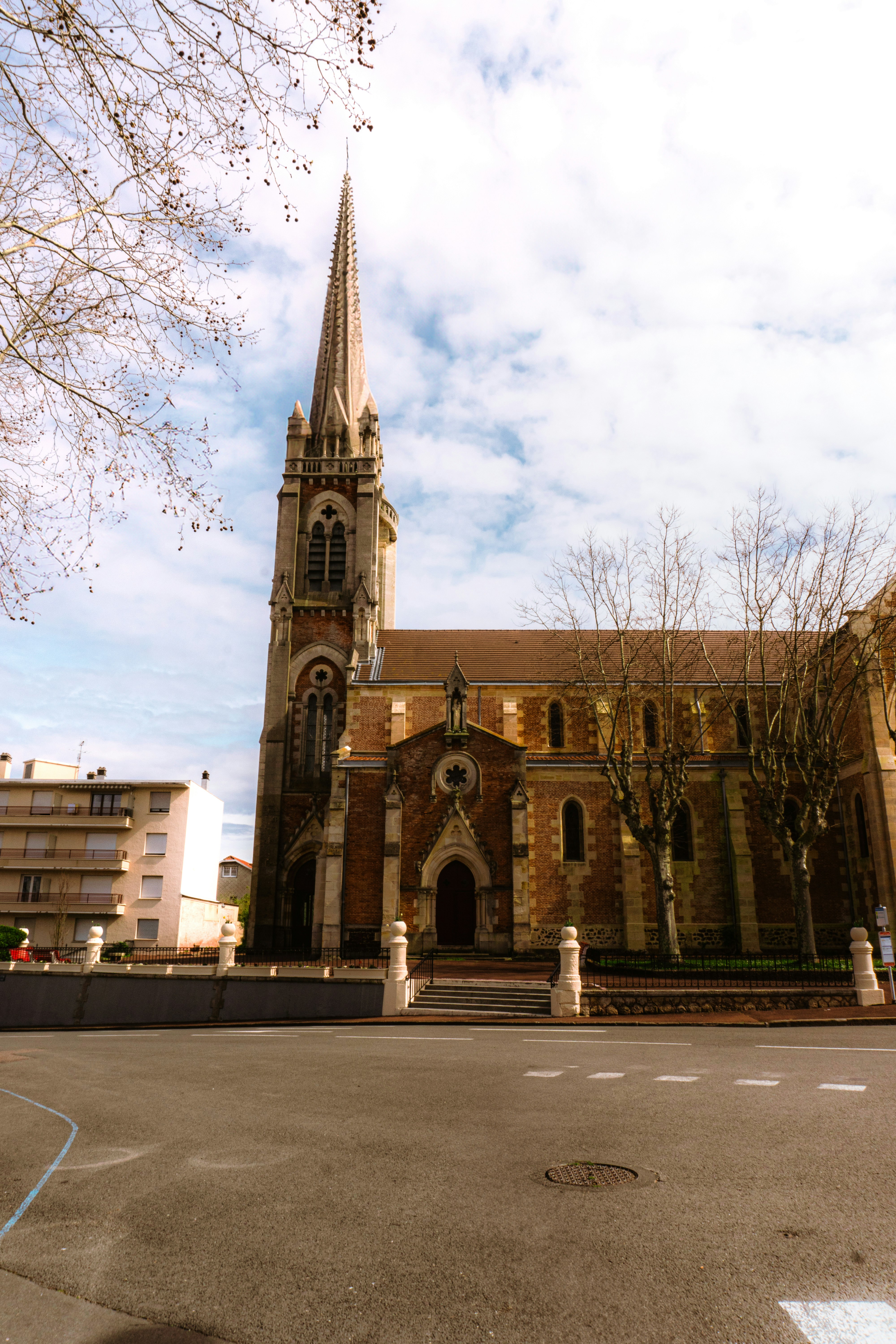 An old church with a steeple and a clock tower